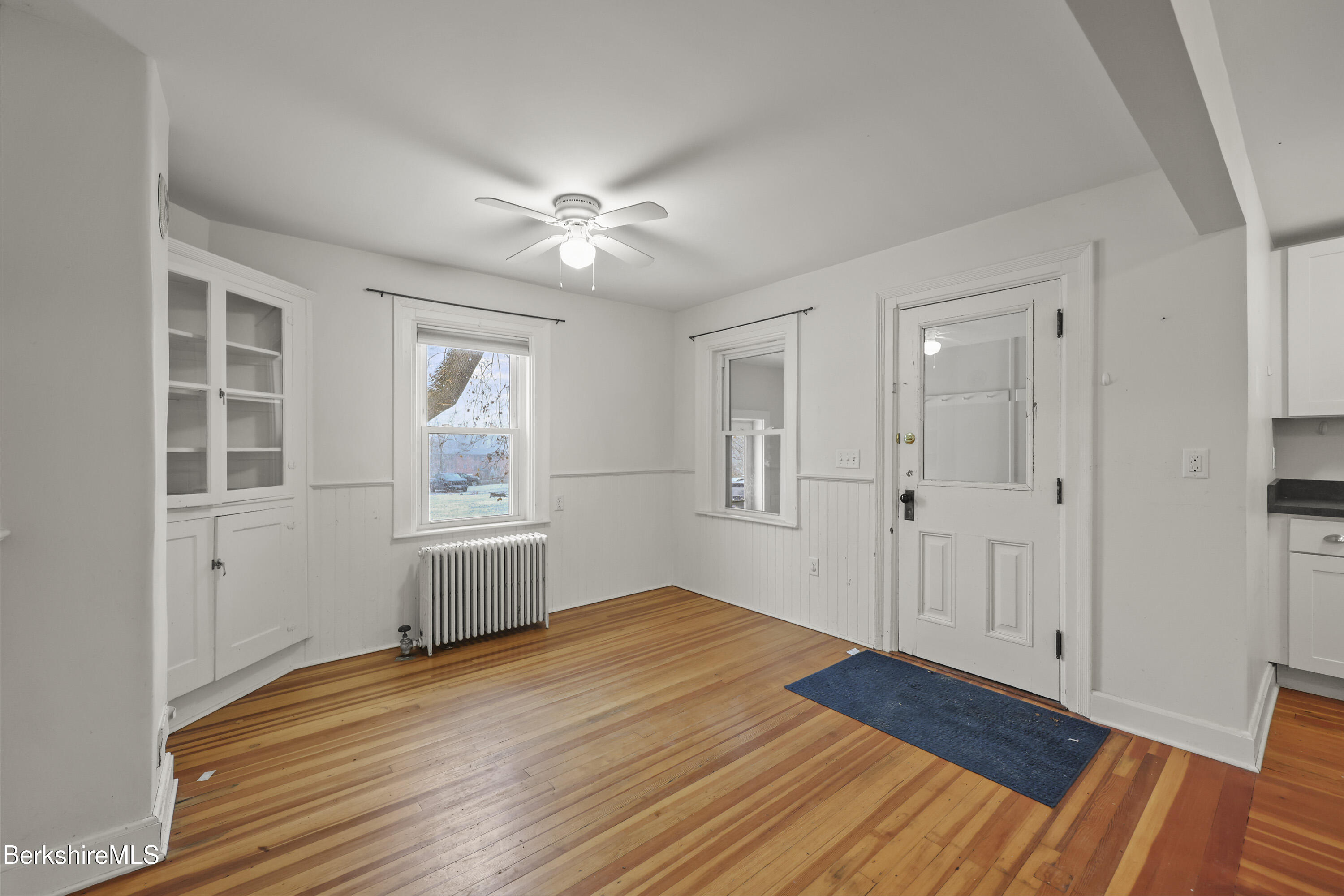 155 Laurel Street Lee, MA 01238 - Photo 17 of 43 a view of empty room with wooden floor and fan