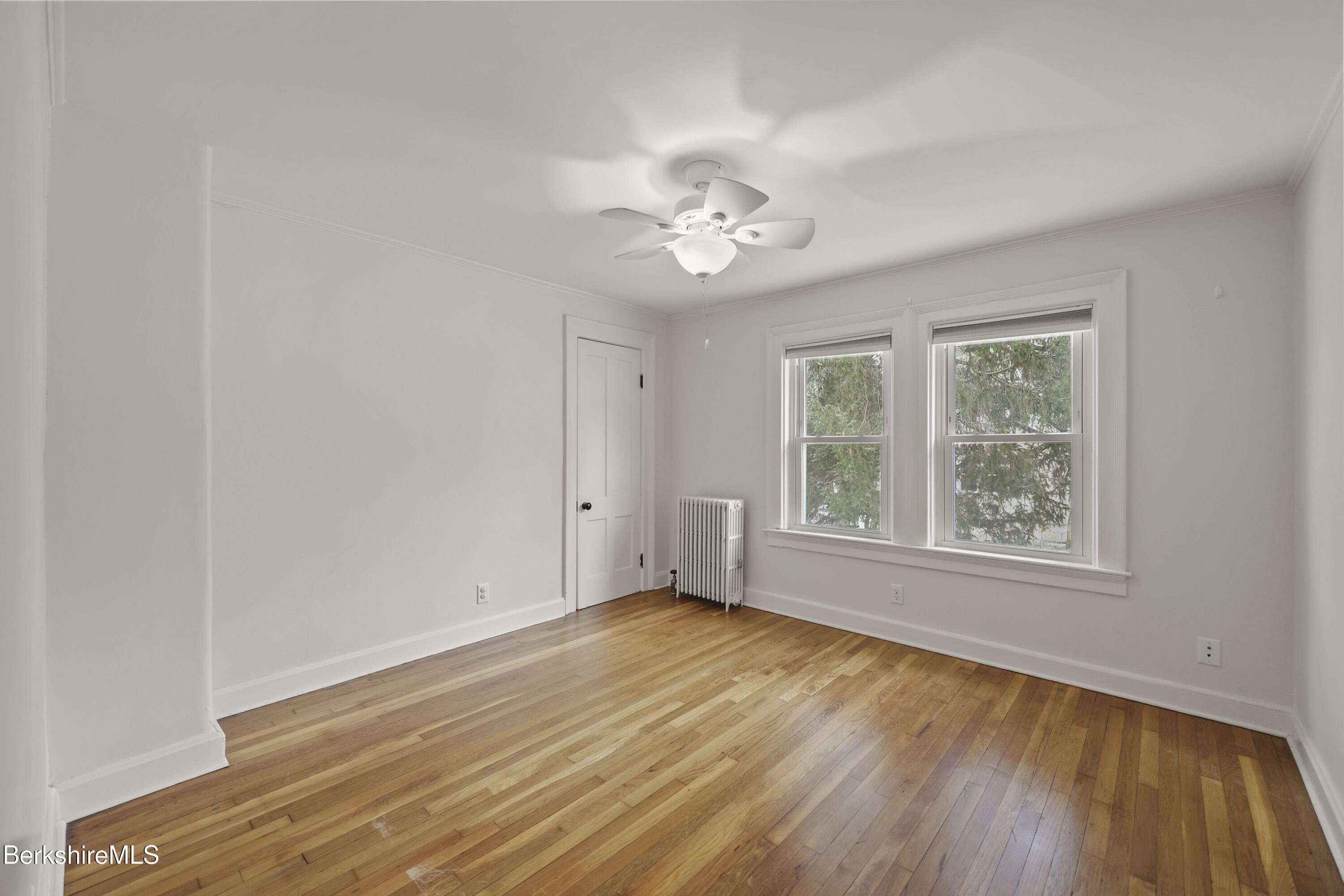 155 Laurel Street Lee, MA 01238 - Photo 27 of 43 a view of empty room with wooden floor and fan