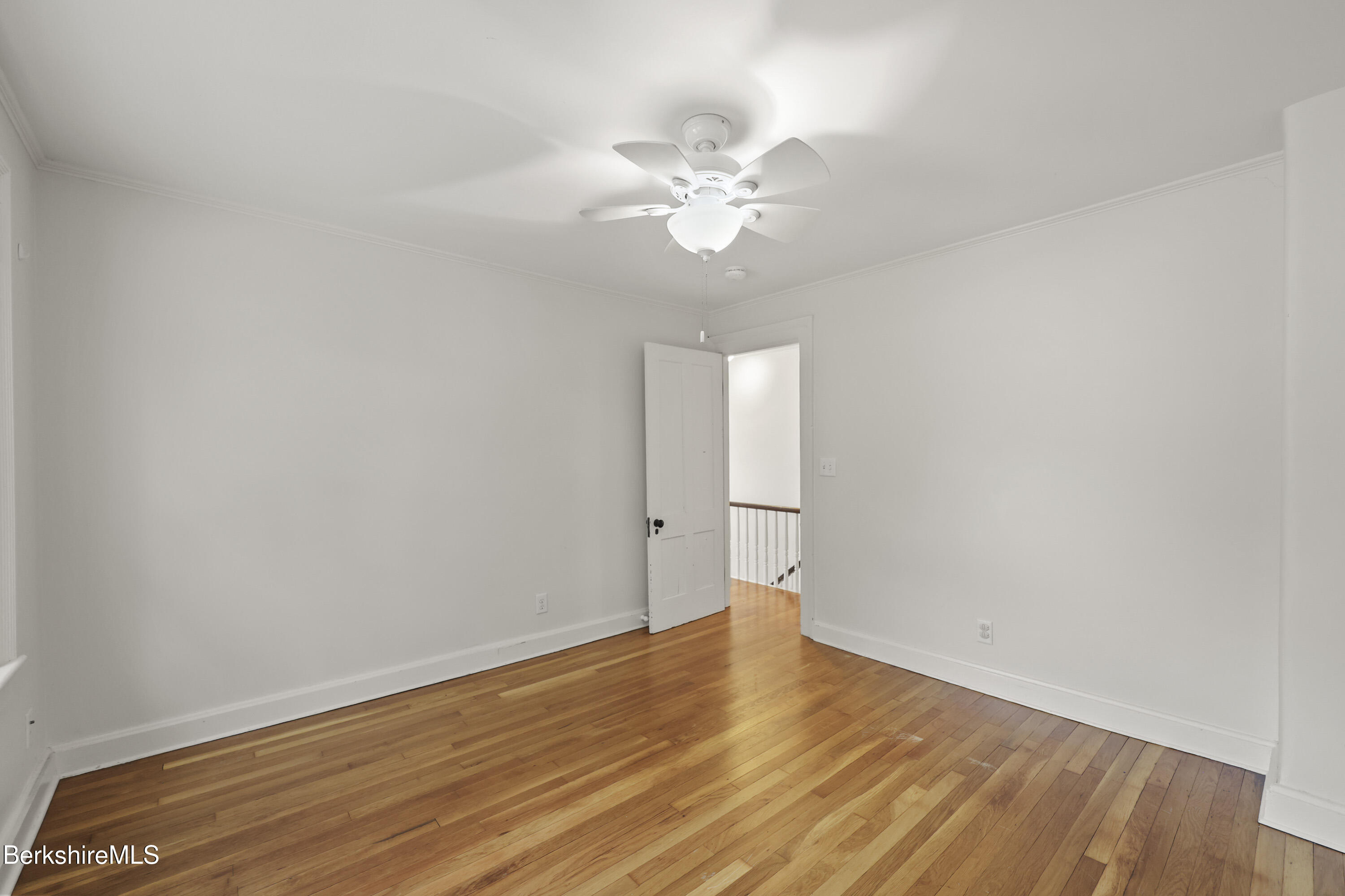 155 Laurel Street Lee, MA 01238 - Photo 28 of 43 a view of a room with wooden floor and ceiling fan
