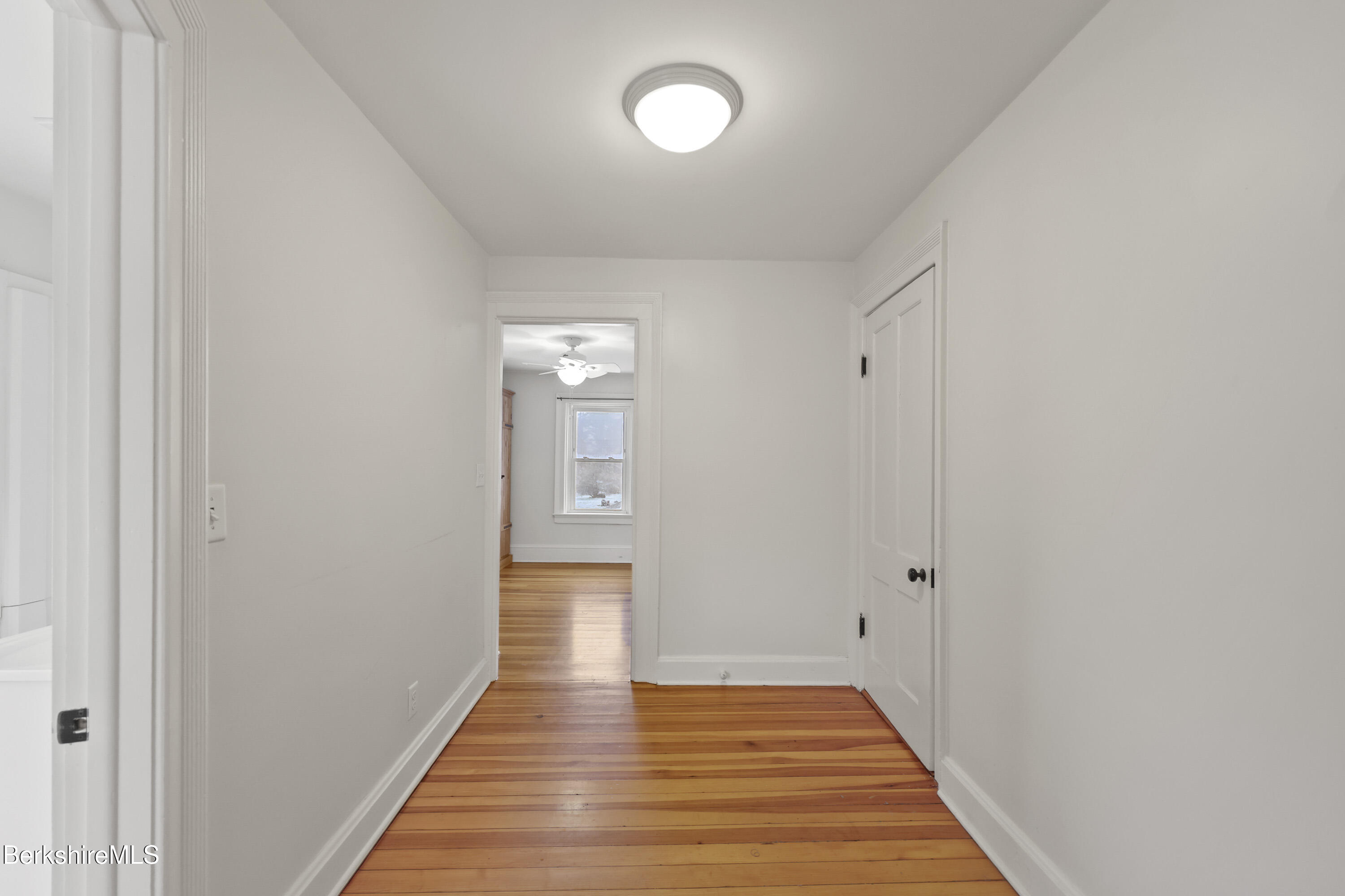 155 Laurel Street Lee, MA 01238 - Photo 31 of 43 a view of a hallway with wooden floor