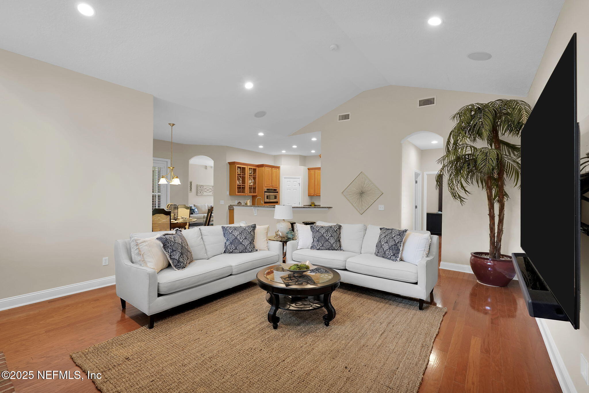 219 Parkside Drive St. Augustine, FL 32095 - Photo 19 of 67 a living room with furniture and a flat screen tv