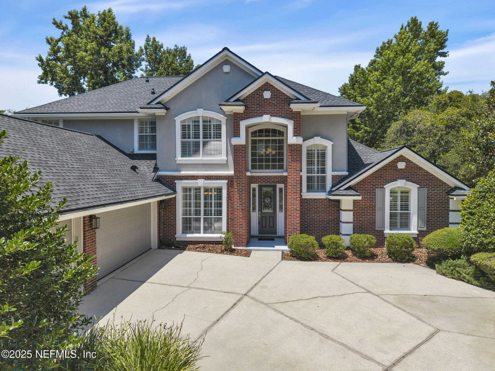 219 Parkside Drive St. Augustine, FL 32095 - Photo 2 of 67 a front view of a house with a garden