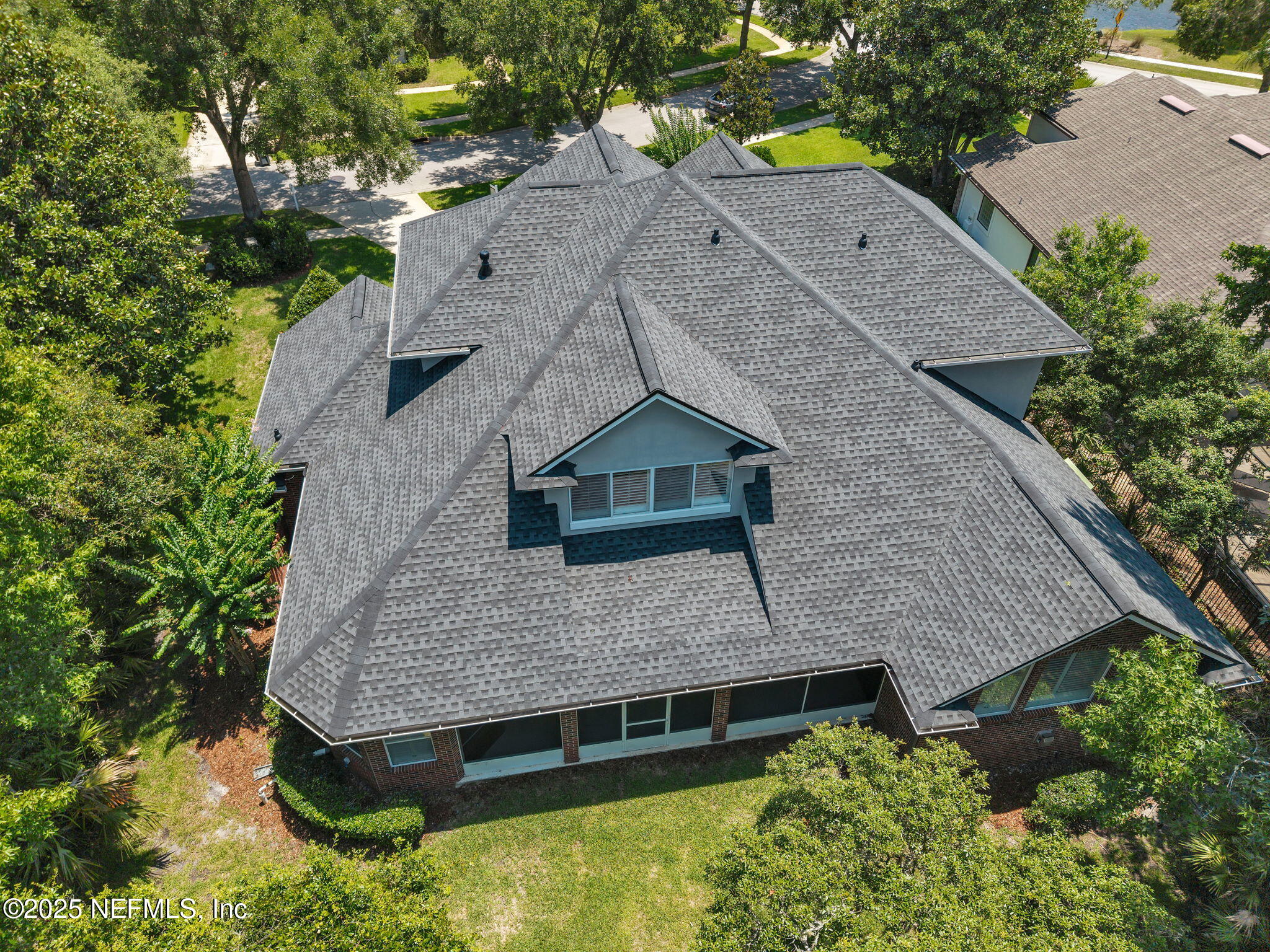219 Parkside Drive St. Augustine, FL 32095 - Photo 3 of 67 an aerial view of a house with a yard and large tree