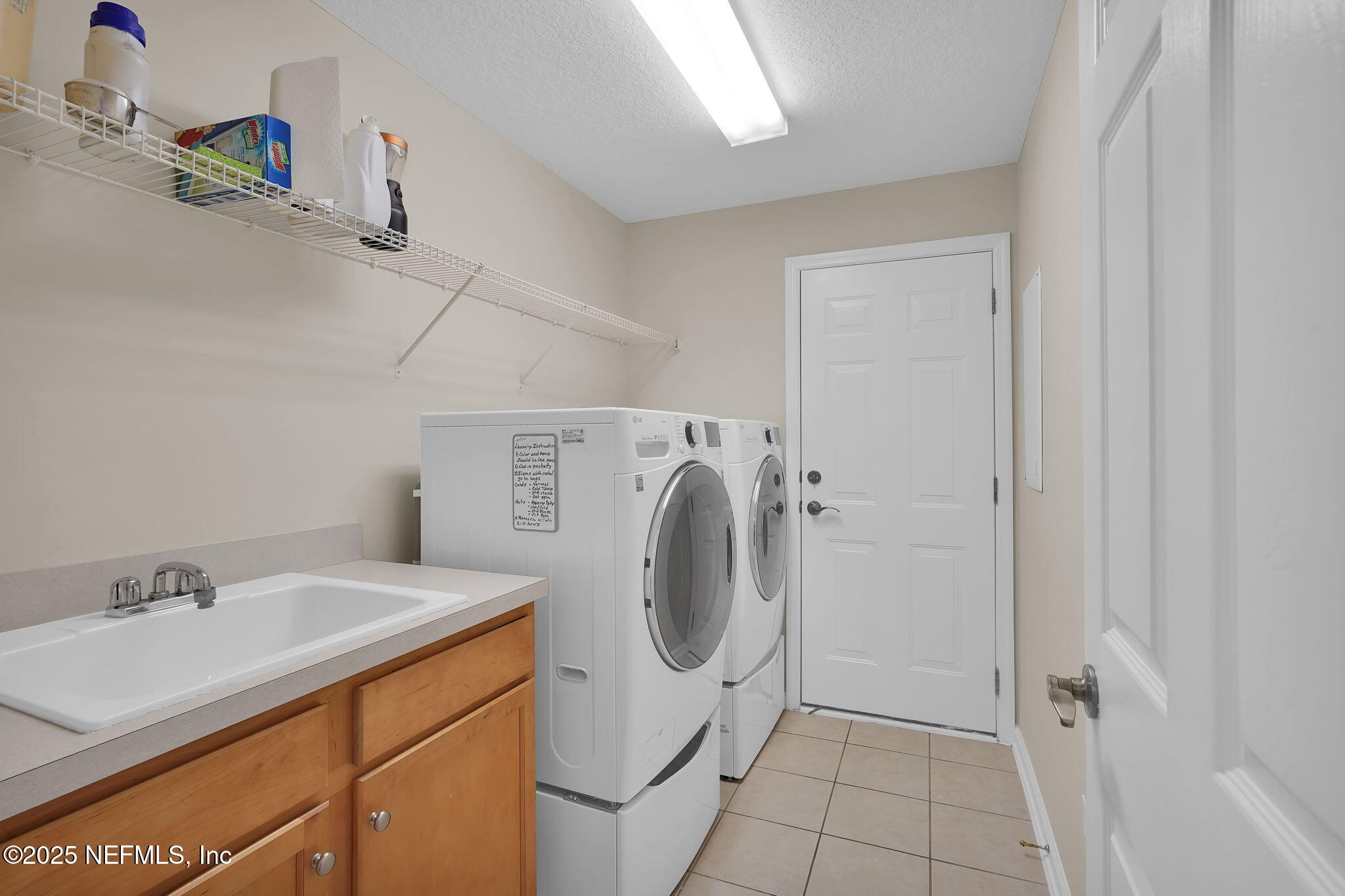 219 Parkside Drive St. Augustine, FL 32095 - Photo 33 of 67 a utility room with dryer and washer
