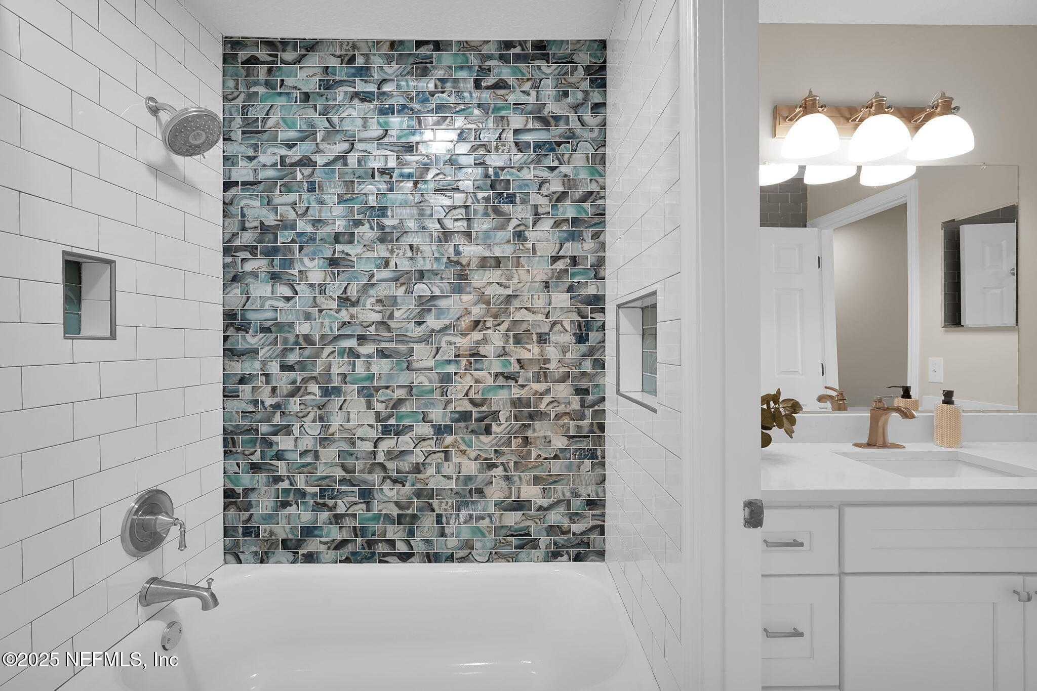 219 Parkside Drive St. Augustine, FL 32095 - Photo 40 of 67 a bathroom with a sink a vanity and a mirror