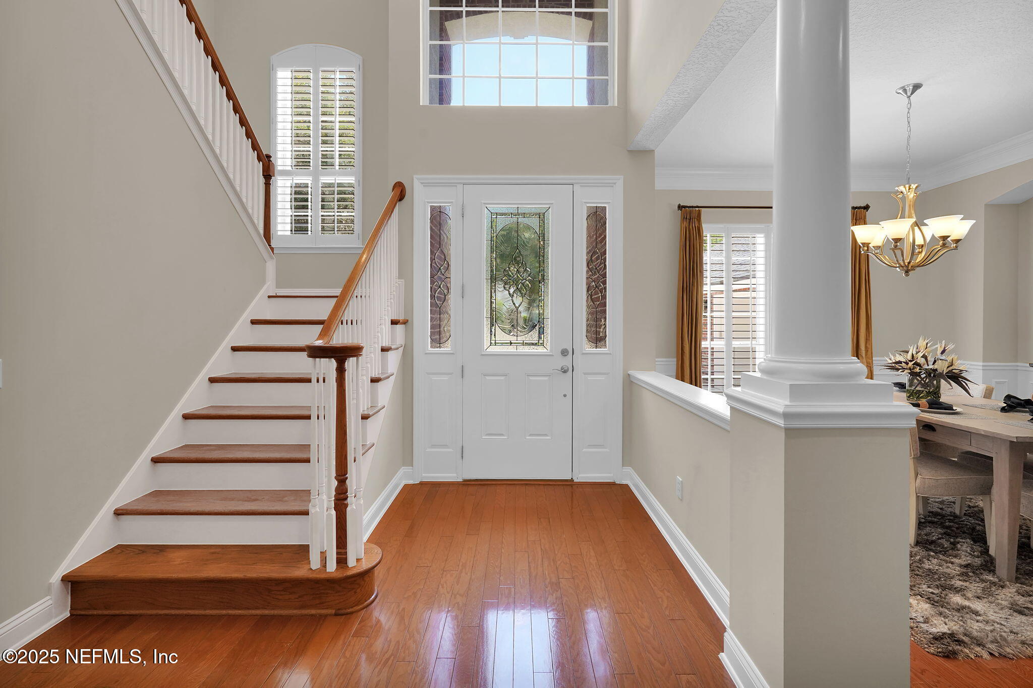 219 Parkside Drive St. Augustine, FL 32095 - Photo 4 of 67 an entryway with wooden floor and staircase