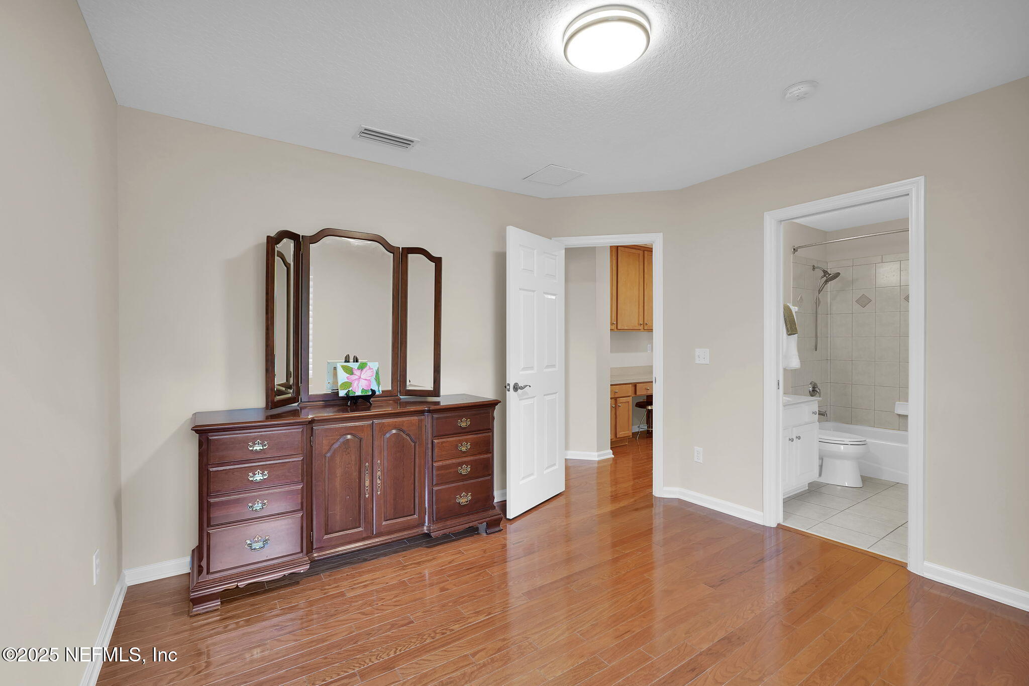 219 Parkside Drive St. Augustine, FL 32095 - Photo 44 of 67 wooden floor with a double vanity sink and mirror