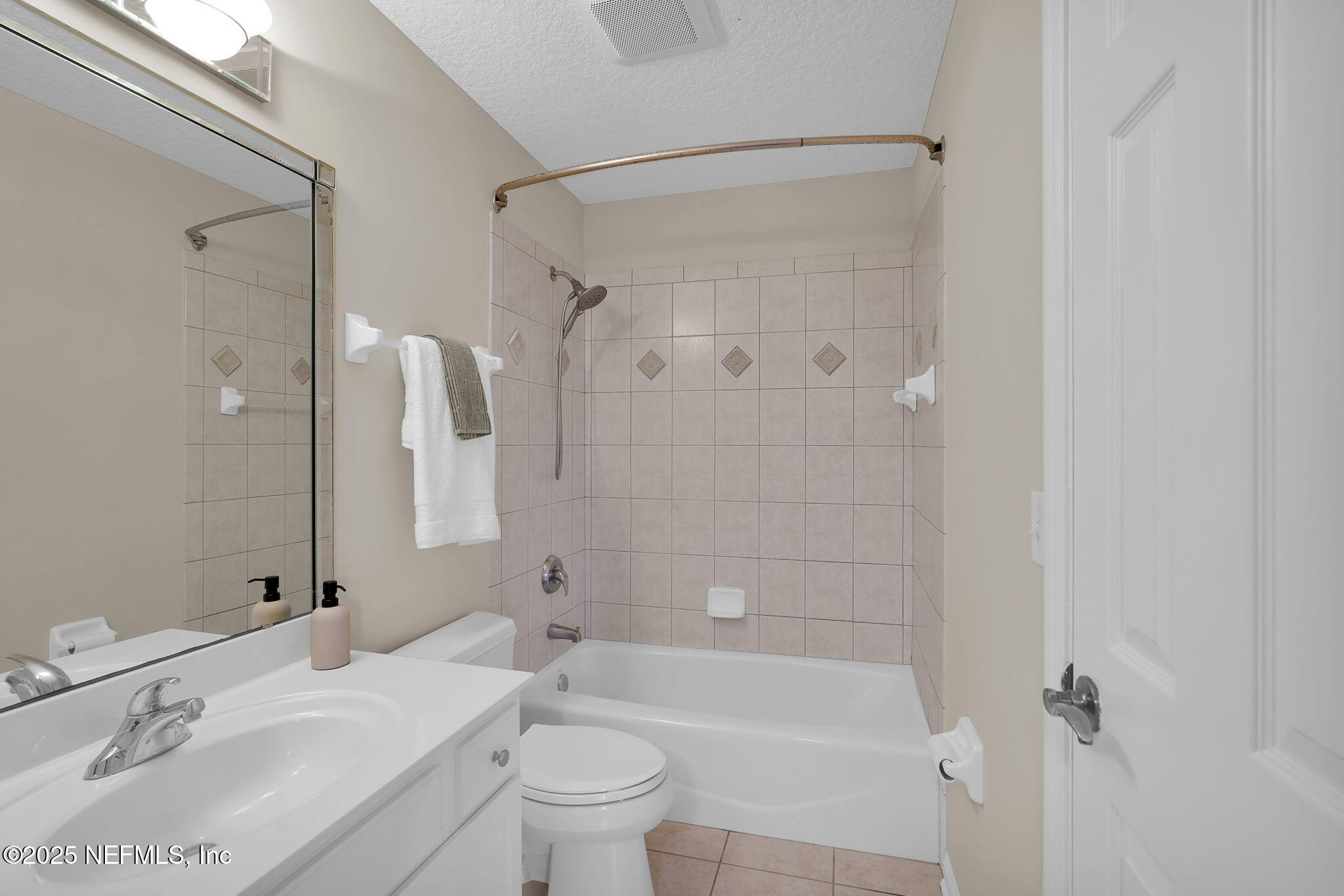 219 Parkside Drive St. Augustine, FL 32095 - Photo 45 of 67 a bathroom with a bathtub shower sink vanity mirror and toilet