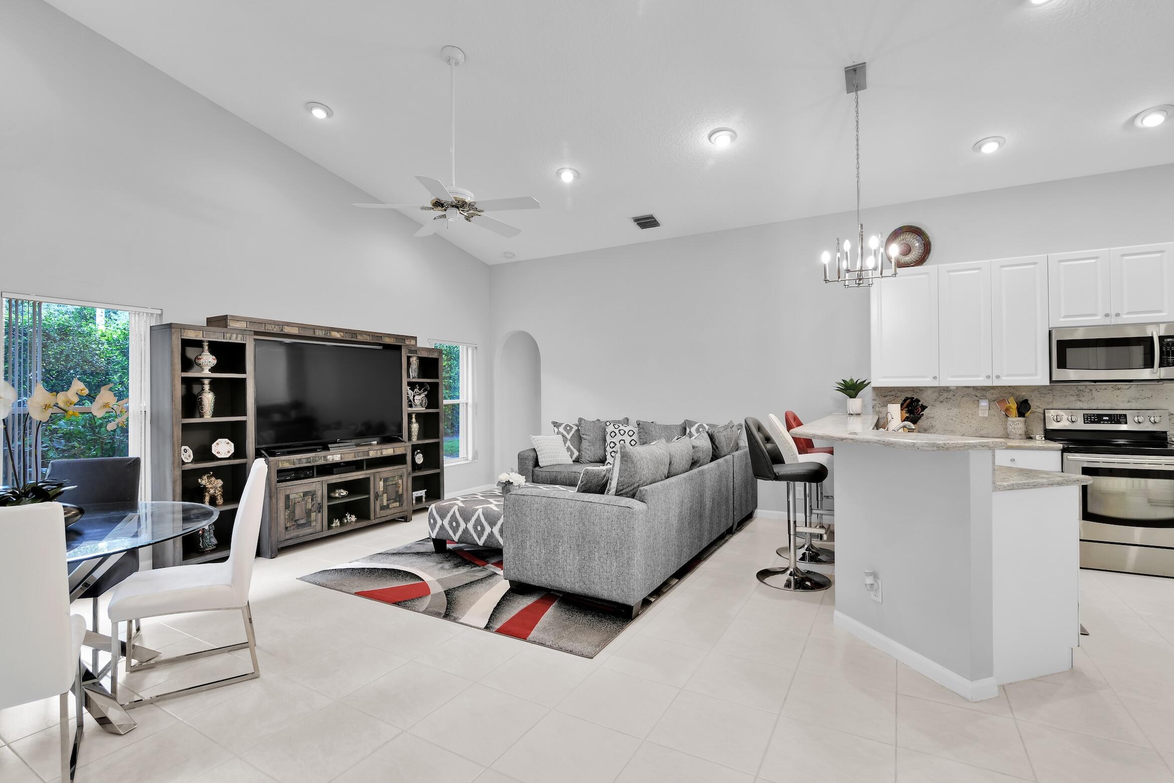 7458 Falls Road West Boynton Beach, FL 33437 - Photo 11 of 45 a living room with furniture and a flat screen tv