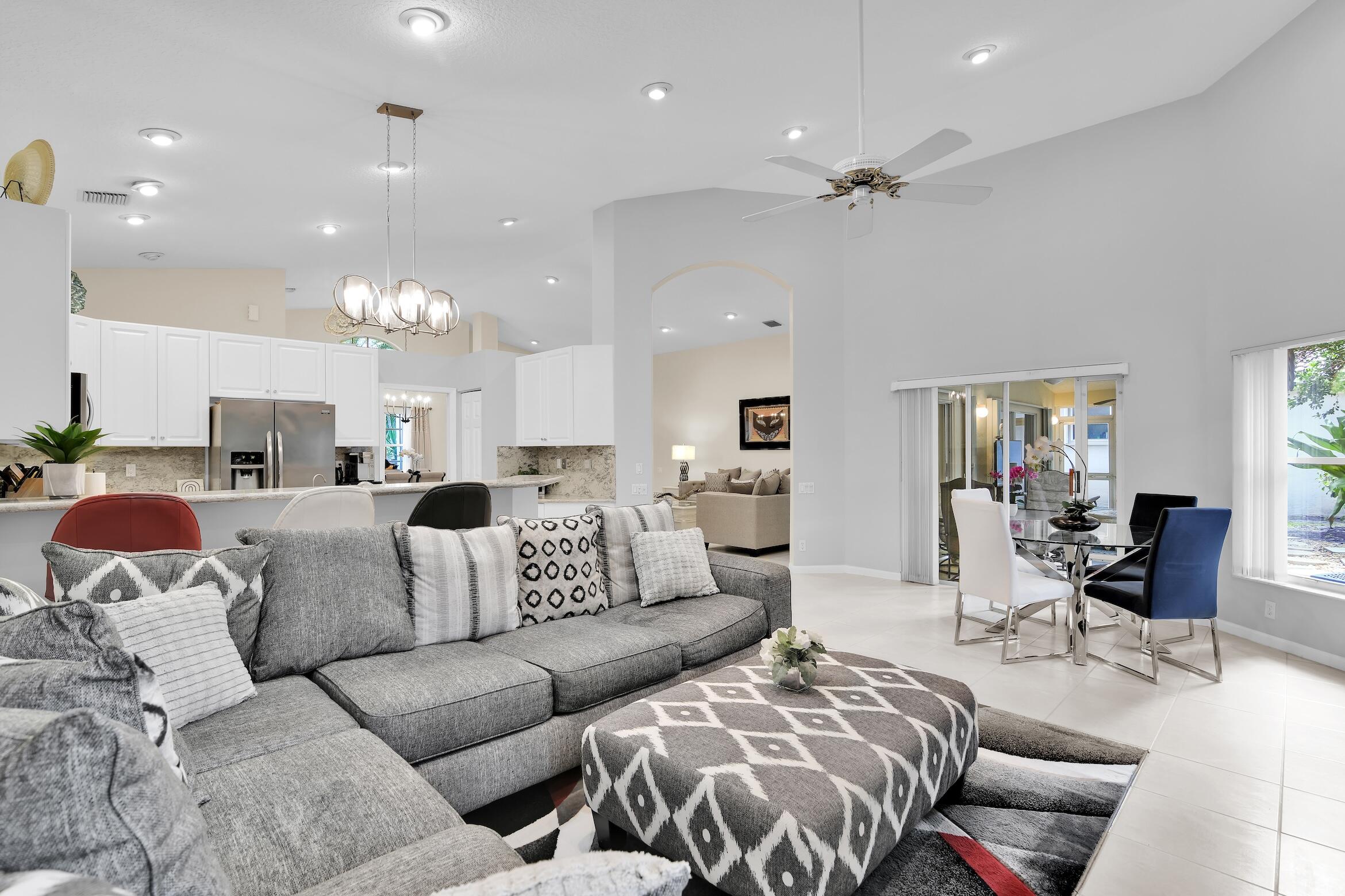 7458 Falls Road West Boynton Beach, FL 33437 - Photo 14 of 45 a living room with furniture and kitchen view