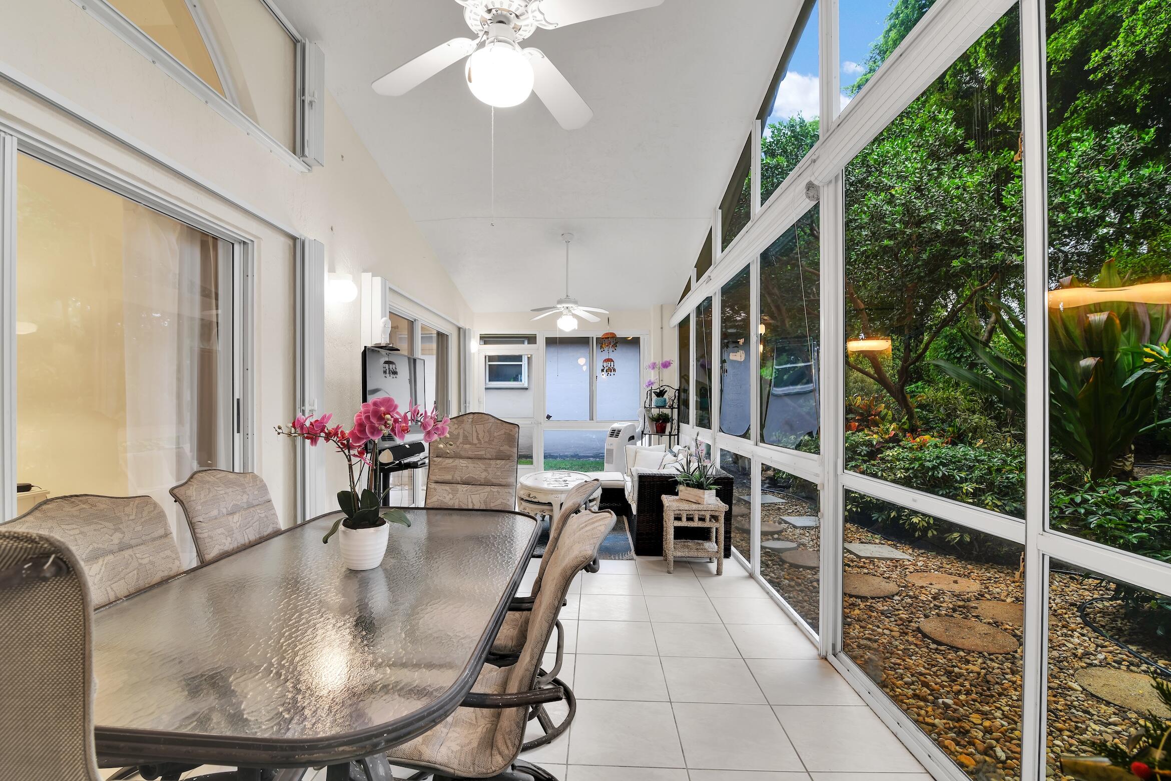 7458 Falls Road West Boynton Beach, FL 33437 - Photo 15 of 45 a dining room with furniture and a large window