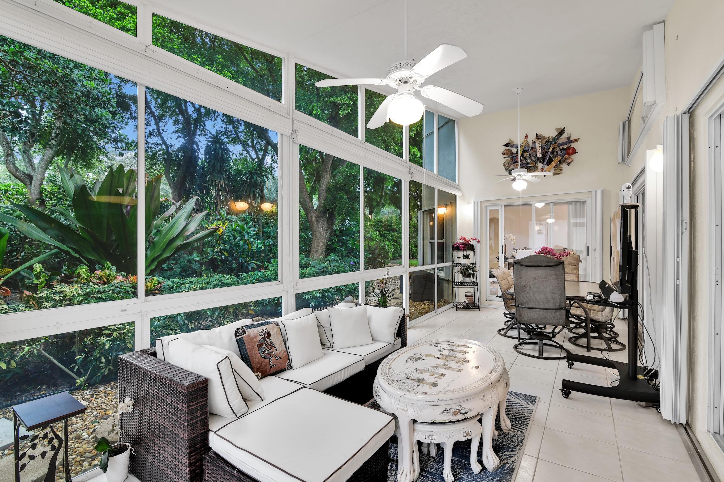 7458 Falls Road West Boynton Beach, FL 33437 - Photo 16 of 45 a living room with furniture and a large window
