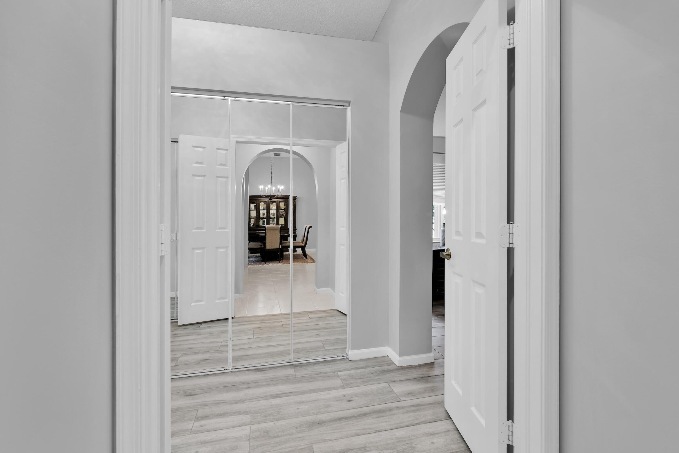 7458 Falls Road West Boynton Beach, FL 33437 - Photo 18 of 45 a view of a livingroom from a hallway