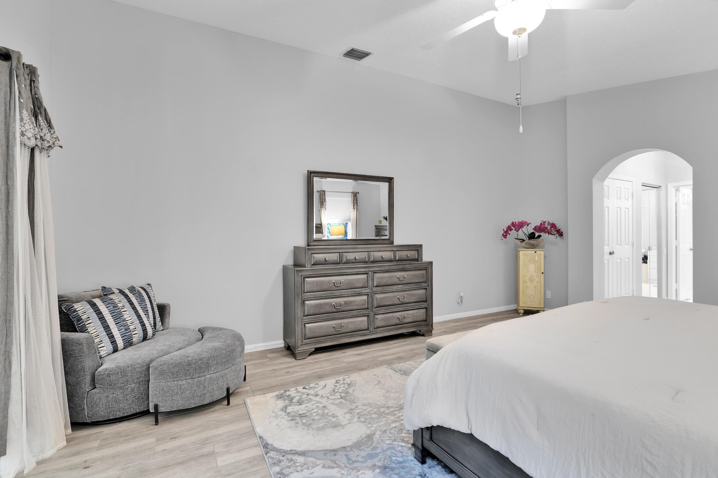 7458 Falls Road West Boynton Beach, FL 33437 - Photo 21 of 45 a bedroom with a bed and furniture