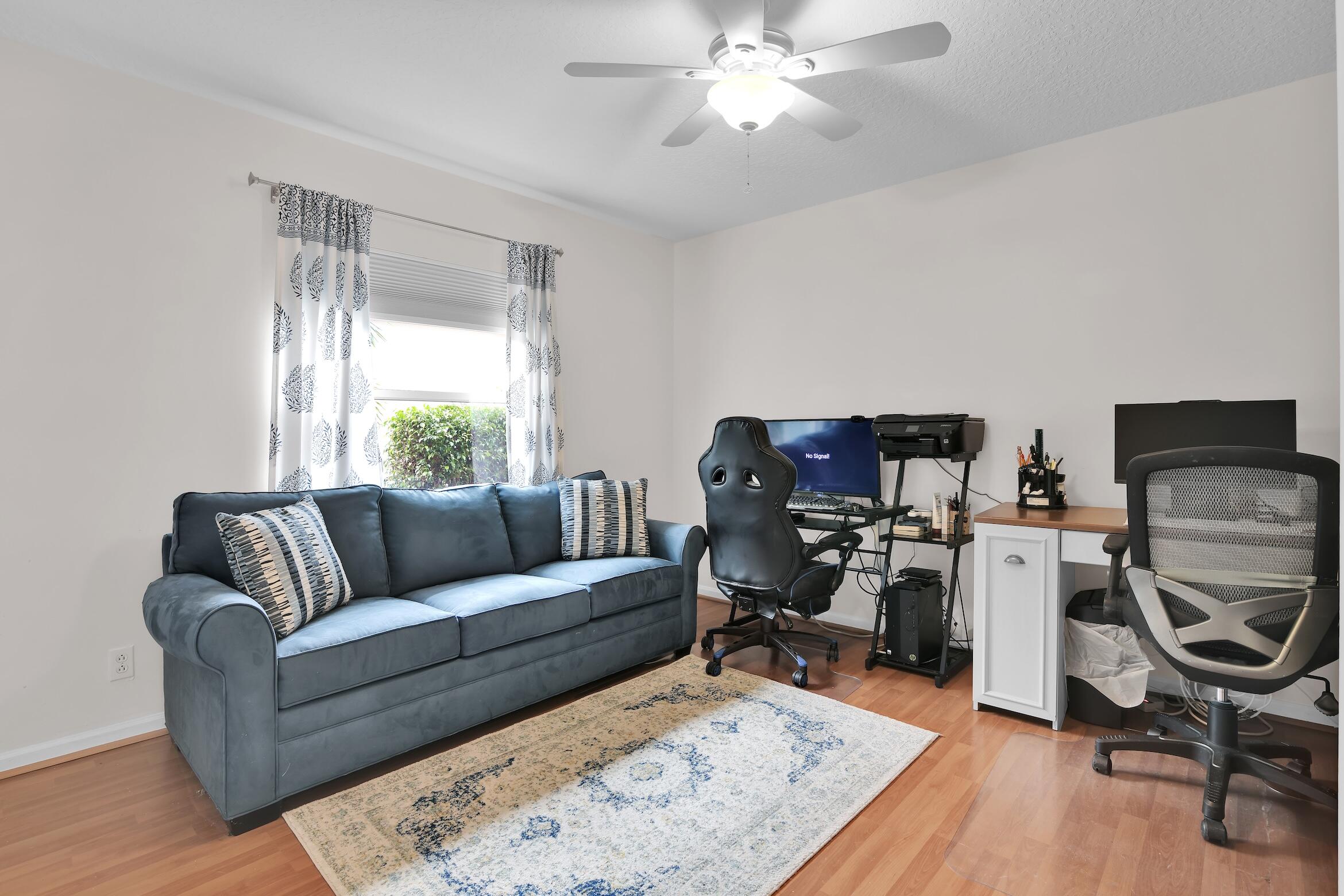 7458 Falls Road West Boynton Beach, FL 33437 - Photo 26 of 45 a living room with furniture and a flat screen tv