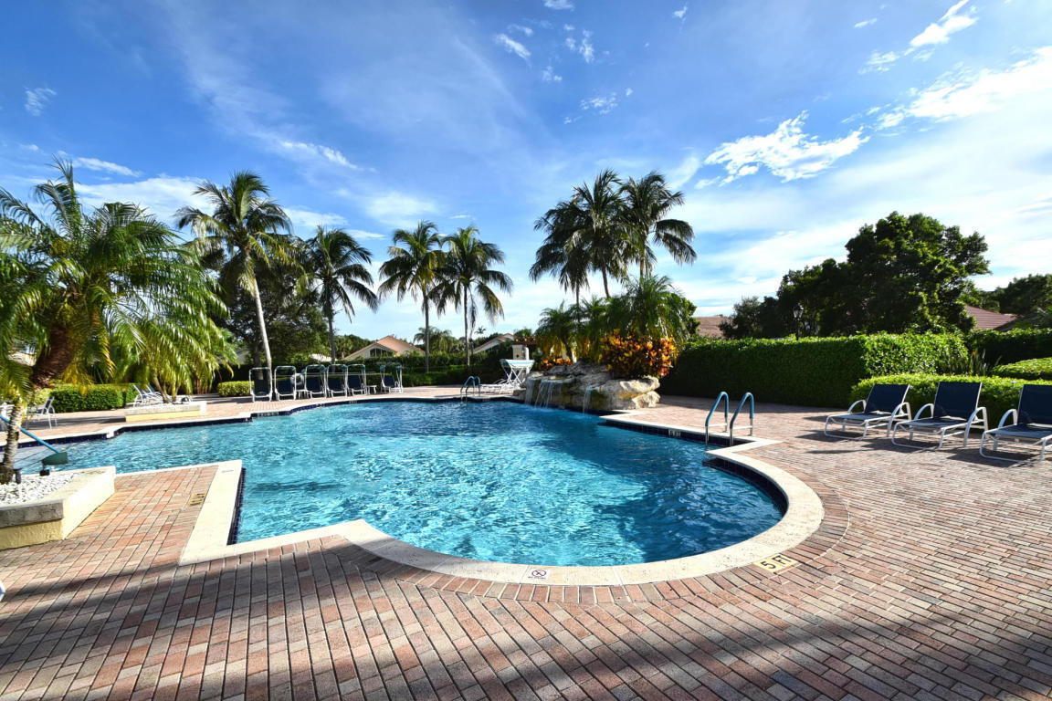 7458 Falls Road West Boynton Beach, FL 33437 - Photo 36 of 45 swimming pool view with a garden space