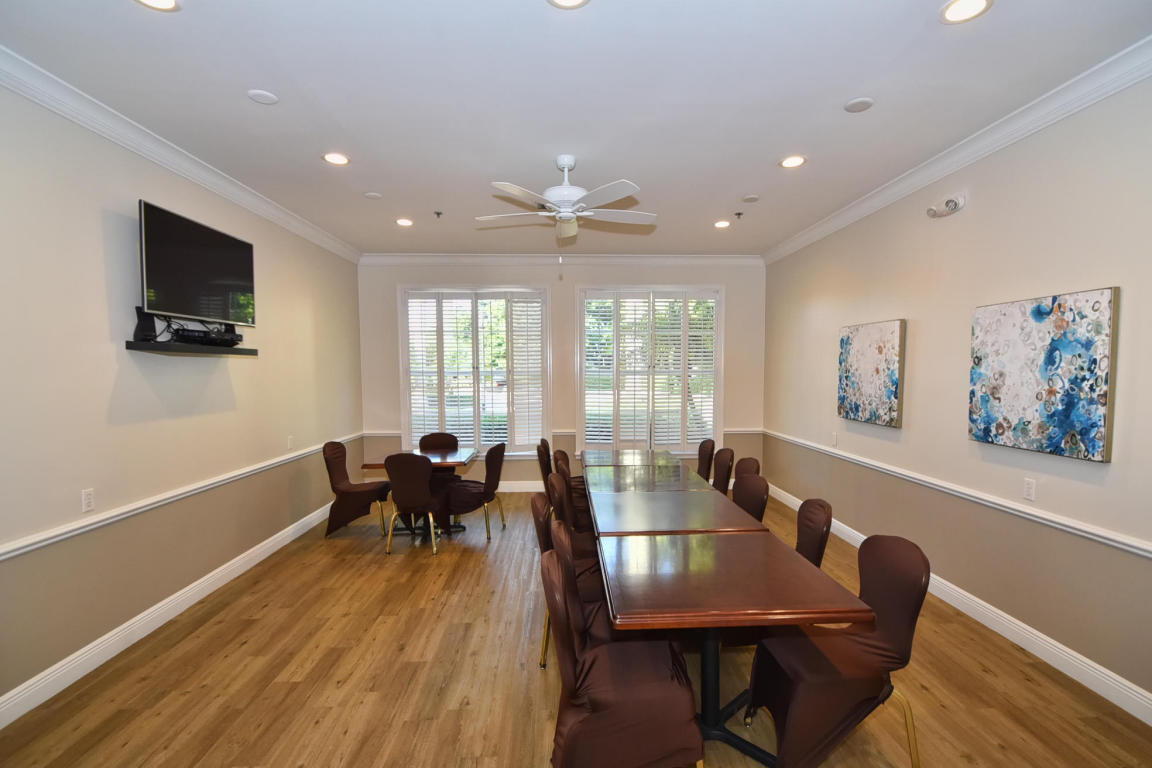 7458 Falls Road West Boynton Beach, FL 33437 - Photo 40 of 45 a view of a dining room with furniture window and wooden floor
