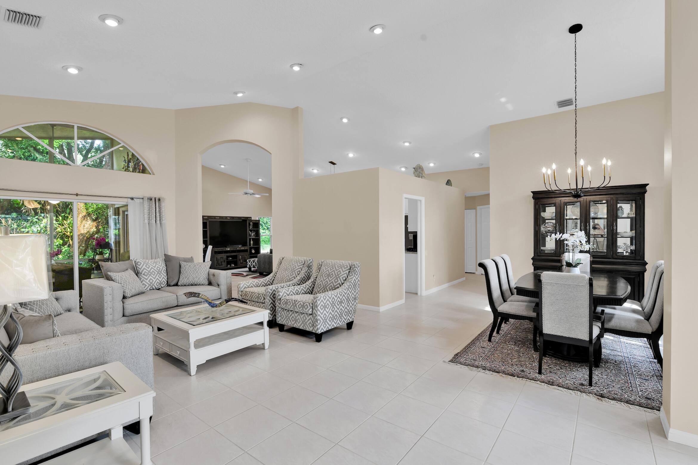 7458 Falls Road West Boynton Beach, FL 33437 - Photo 4 of 45 a living room with furniture kitchen view and a large window
