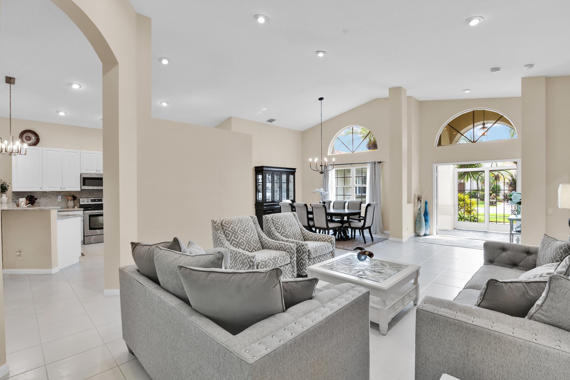 7458 Falls Road West Boynton Beach, FL 33437 - Photo 6 of 45 a living room with furniture and a large window