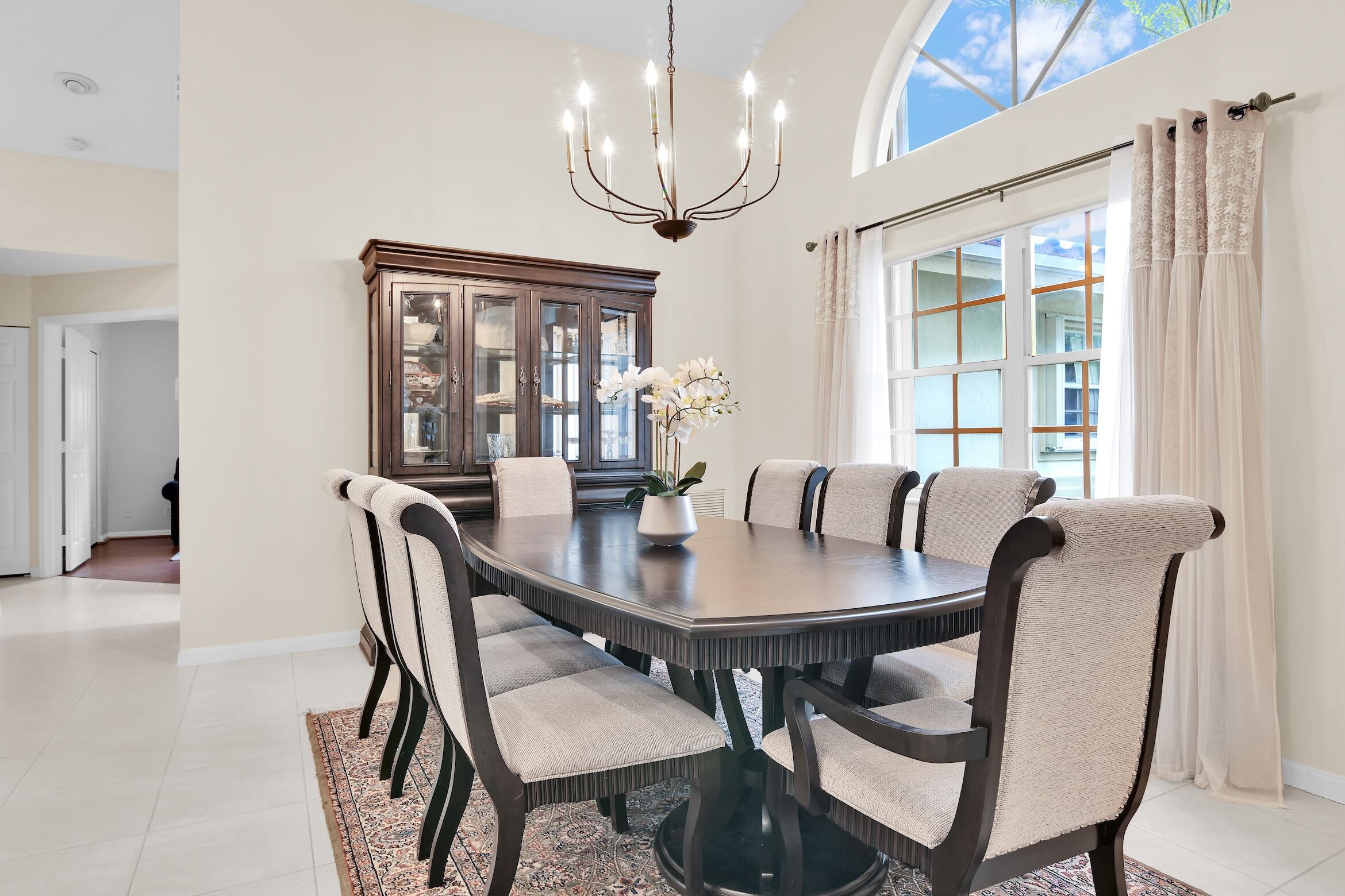 7458 Falls Road West Boynton Beach, FL 33437 - Photo 8 of 45 a view of a dining room with furniture window and wooden floor