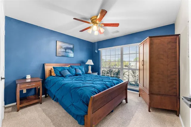 a bed room with a bed and a window