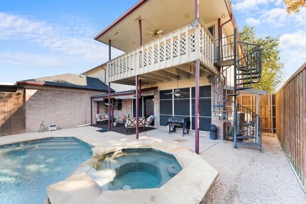 5509 Allen Lane Rowlett, TX 75088 - Photo 26 of 34 Rear view of property with ceiling fan, a fenced backyard, stairway, and brick siding