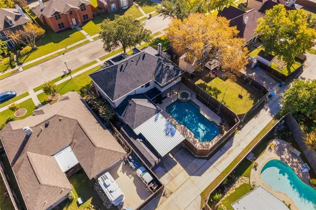 an aerial view of a residential apartment building with yard
