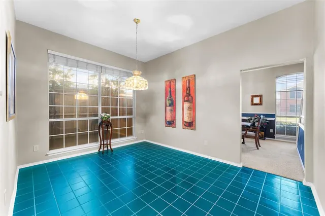 a view of a livingroom with wooden floor and furniture