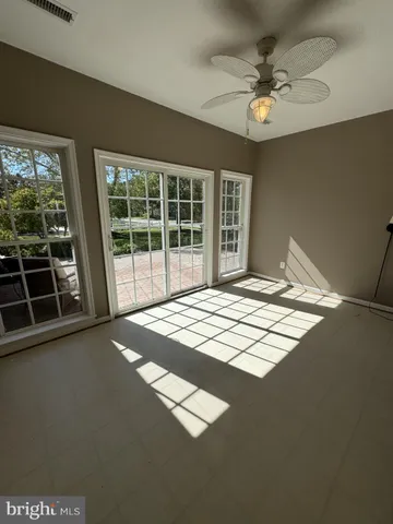 a view of an empty room with windows