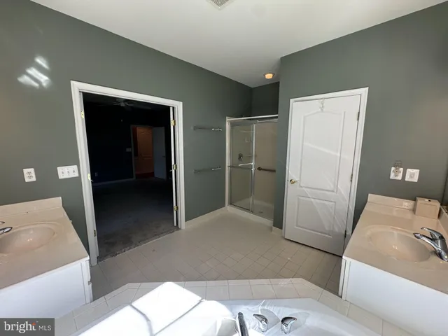 a bathroom with a sink and mirror