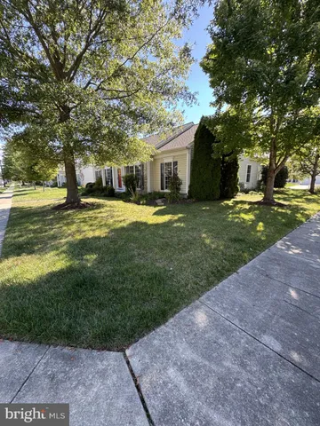 a view of a house with a small yard