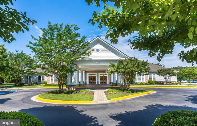 a room with furniture pool table table and a window