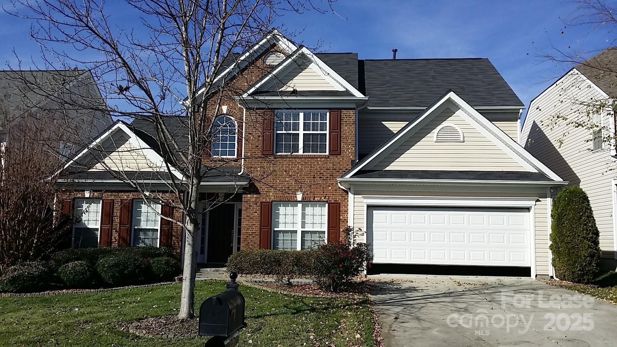 1595 Tranquility Avenue Northwest Concord, NC 28027 - Photo 2 of 14 a front view of a house with a garden and plants