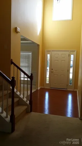 a view of a hallway with staircase