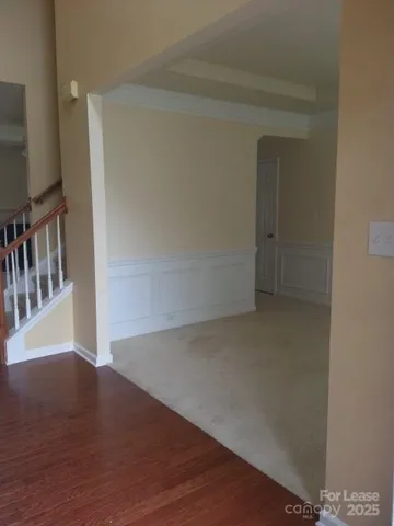 a view of hallway with wooden floor