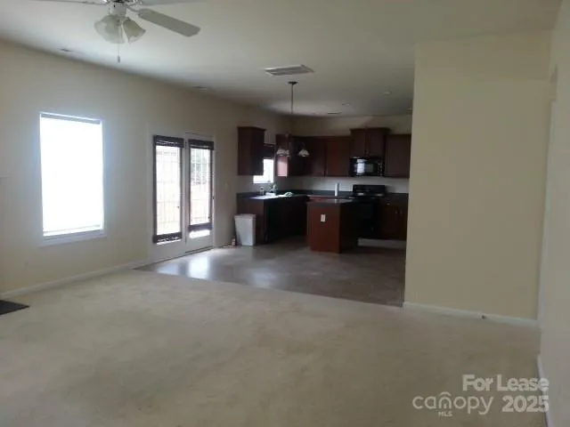 a kitchen with a sink and a refrigerator