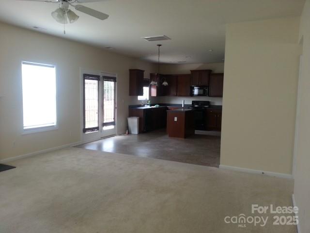 1595 Tranquility Avenue Northwest Concord, NC 28027 - Photo 7 of 14 a kitchen with a sink and a refrigerator
