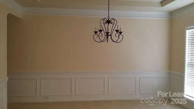a view of a room that has a lot of white walls