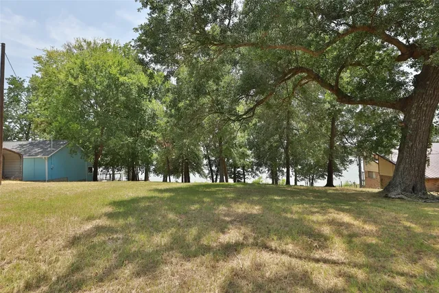 a view of a large body of water with a building in the background