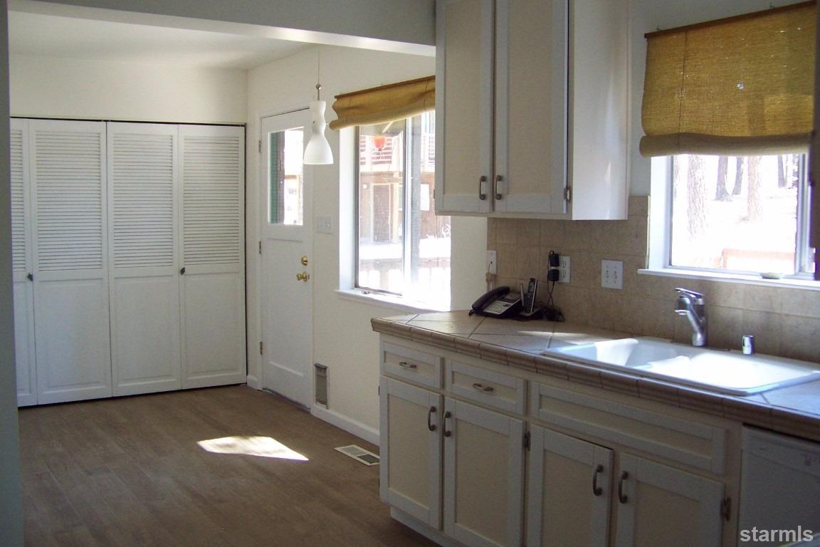 165 Pinion Road Markleeville, CA 96120 - Photo 16 of 34 a kitchen with a sink cabinets and window