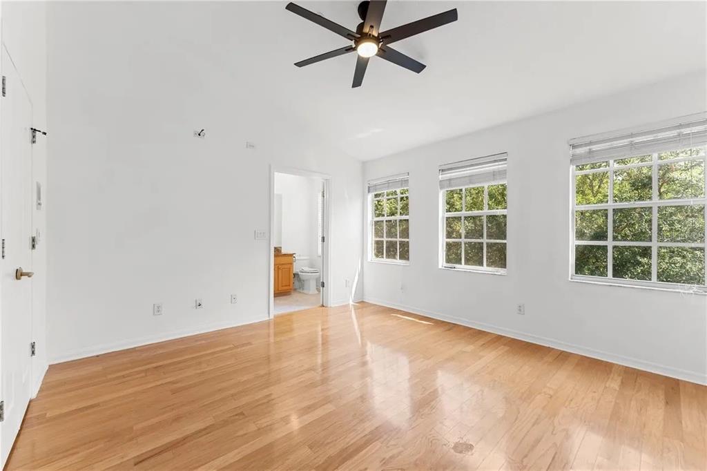 1437 Harbour Walk Road Tampa, FL 33602 - Photo 19 of 32 wooden floor in an empty room with a window