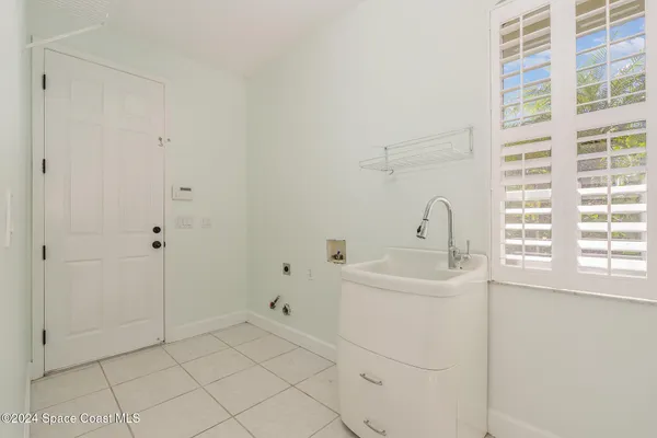 a bathroom with a sink a toilet and a shower