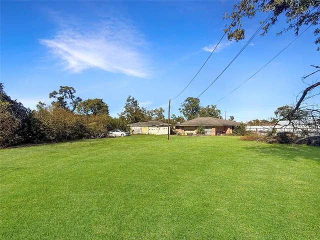 a backyard of a house with lots of green space