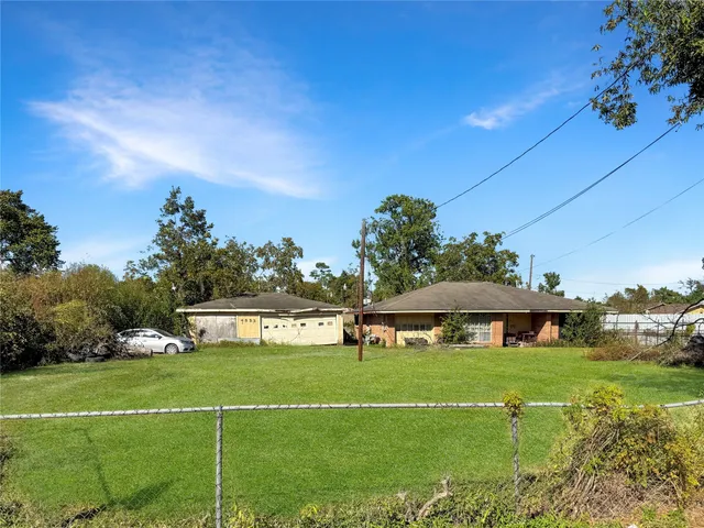 a view of a swimming pool and trees in the background