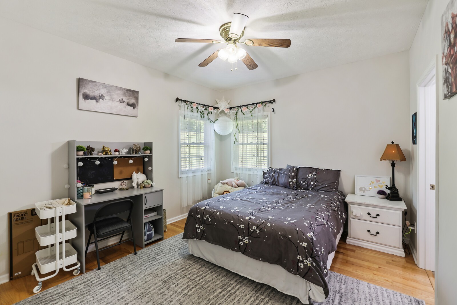 2219 Mack Benderman Road Culleoka, TN 38451 - Photo 16 of 40 a bedroom with a bed and a chandelier