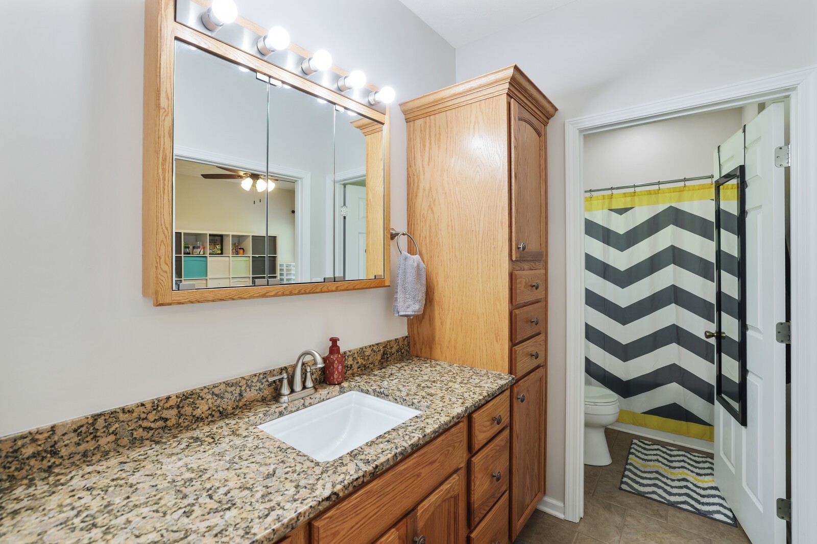 2219 Mack Benderman Road Culleoka, TN 38451 - Photo 17 of 40 a bathroom with a granite countertop sink and a mirror