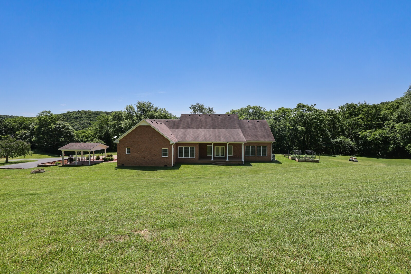 2219 Mack Benderman Road Culleoka, TN 38451 - Photo 33 of 40 a house with a yard
