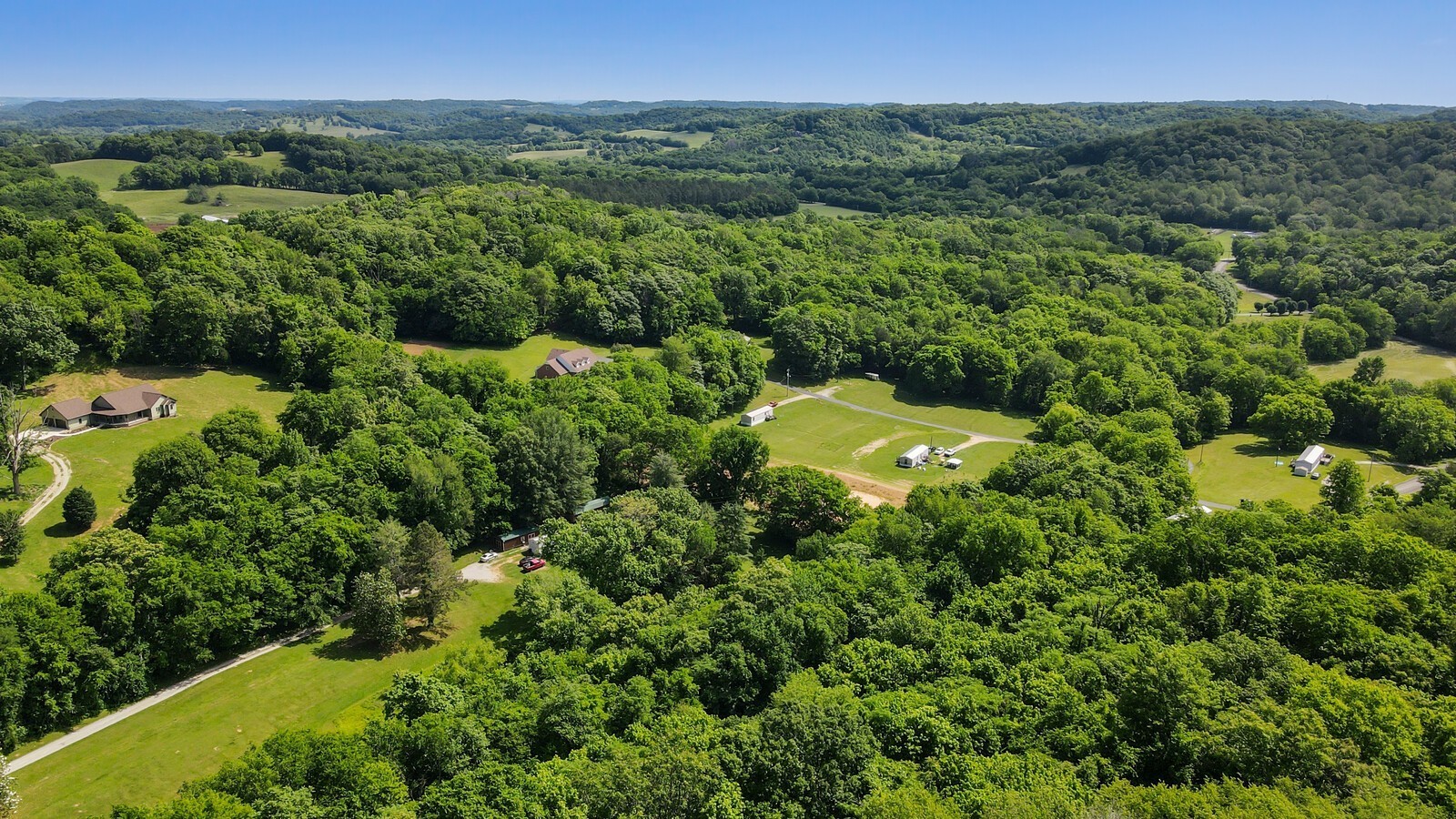 2219 Mack Benderman Road Culleoka, TN 38451 - Photo 38 of 40 an aerial view of a house with a yard
