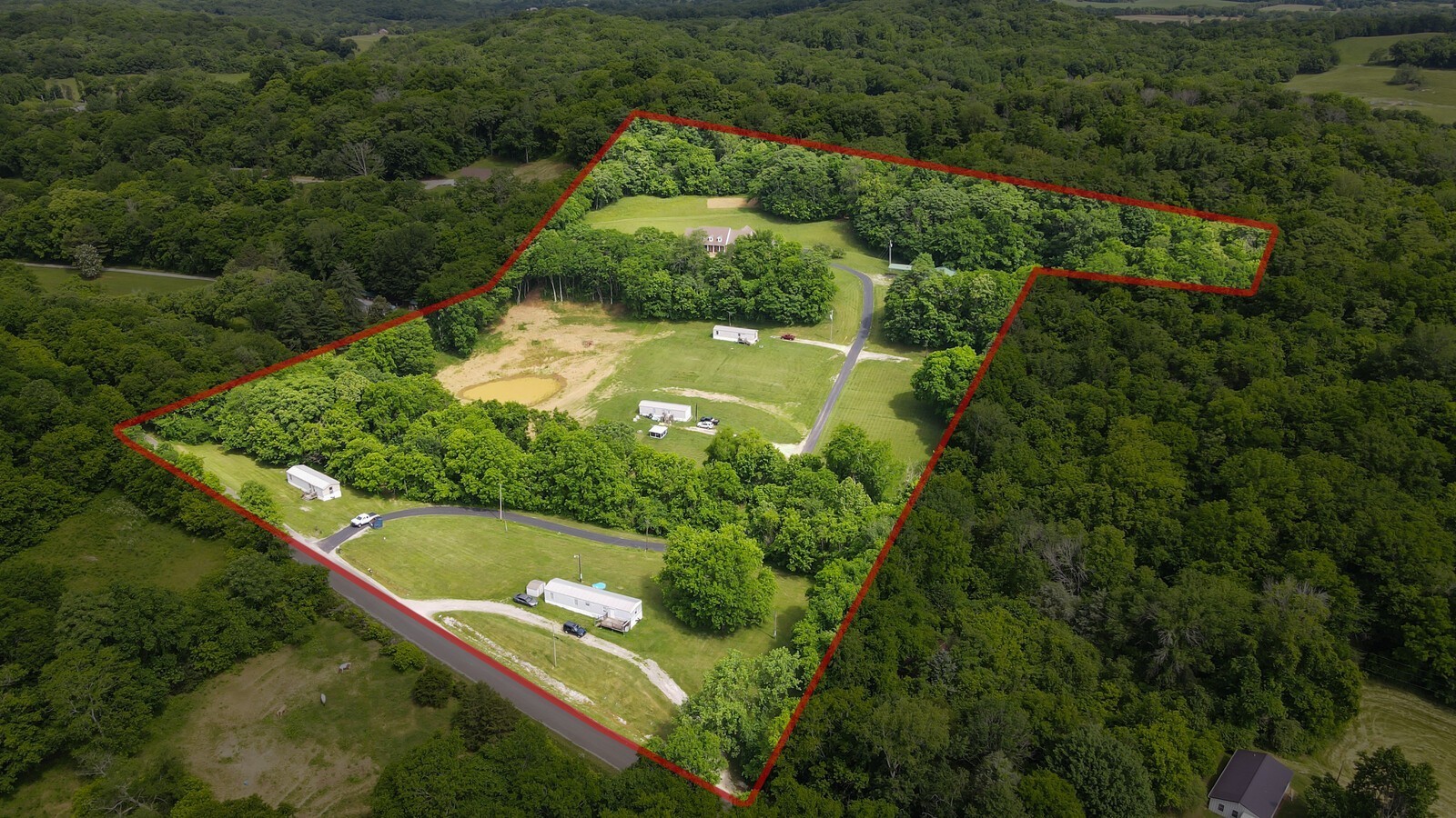 2219 Mack Benderman Road Culleoka, TN 38451 - Photo 4 of 40 an aerial view of residential house with outdoor space and trees all around