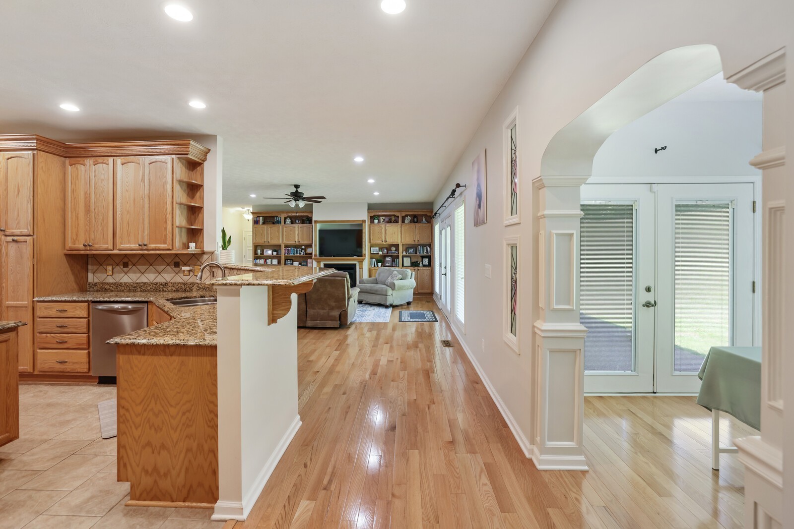 2219 Mack Benderman Road Culleoka, TN 38451 - Photo 8 of 40 a kitchen with white cabinets and stainless steel appliances